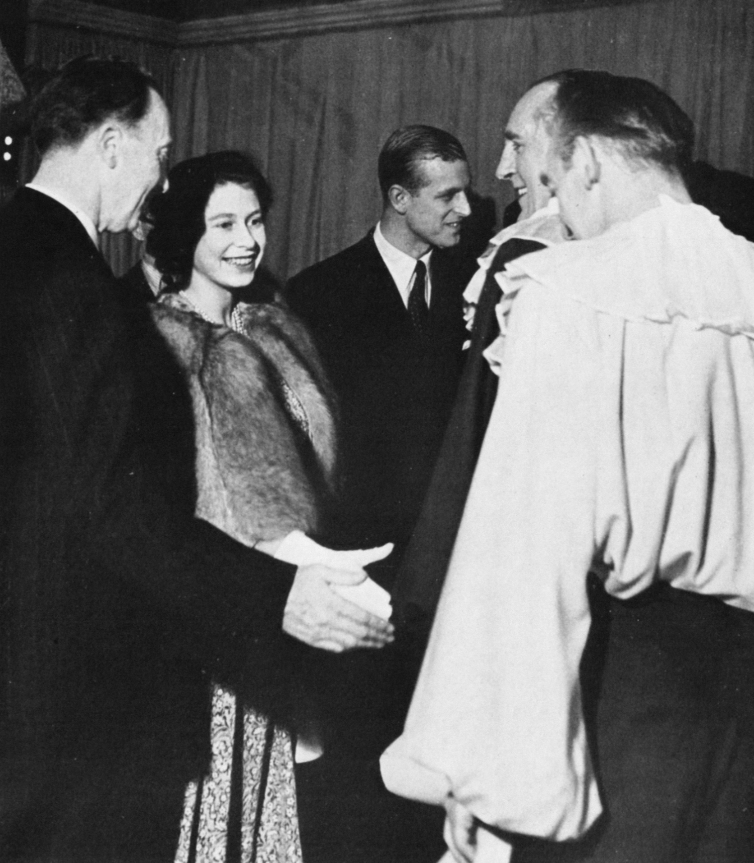 Princess Elizabeth, heir to the British throne, and her husband meet a cast of actors